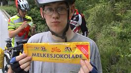 Olly has consumed an entire, huge bar of Norwegian chocolate to rekindle his Cycling Drive, and everyone else is eating whatever they can find, near Tysdland, 30.4 miles into the ride